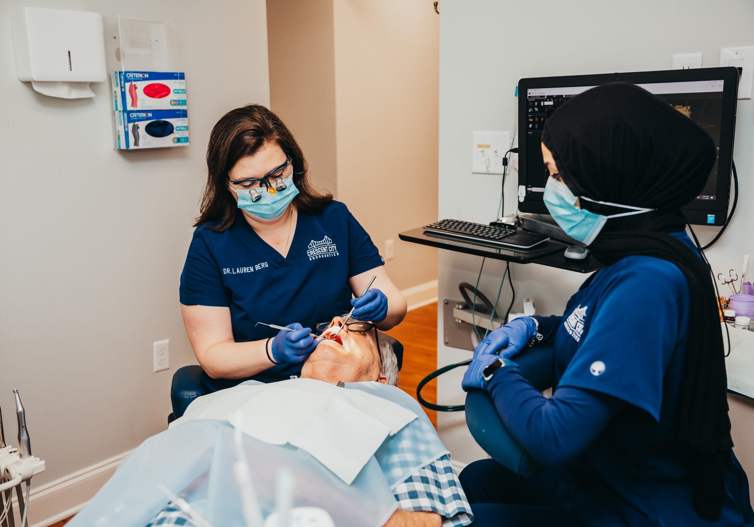 Photo of Dr. Berg with Patient