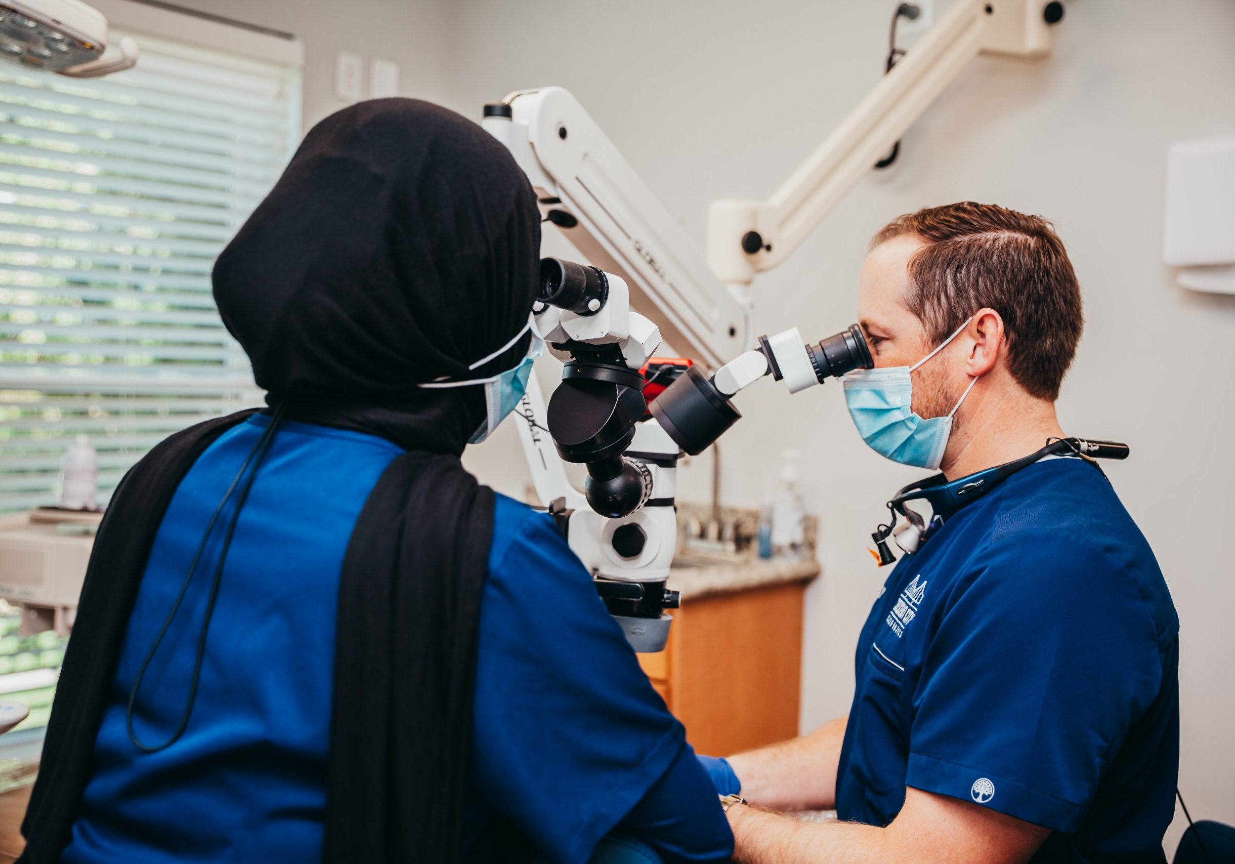 Dr. Lally Looking through the microscope